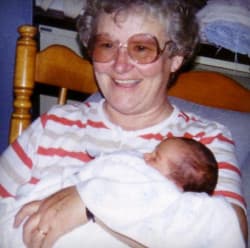 Grandmother holding baby Jona.
