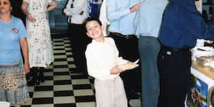 Jona standing in line at a church gathering.