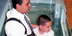 Jona gets baptized by his dad.